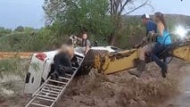 Watch: Mother, child rescued after flash flood swamps car in New Mexico